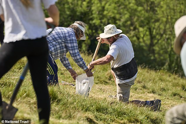 National Trust volunteers restore Cerne Abbas Giant with 17 tonnes of chalk.